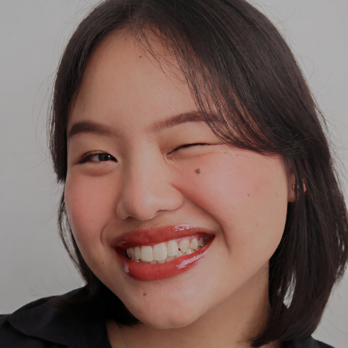 Peptide Glo Lip Oil in Cherry Jam worn on model (4 of 4)