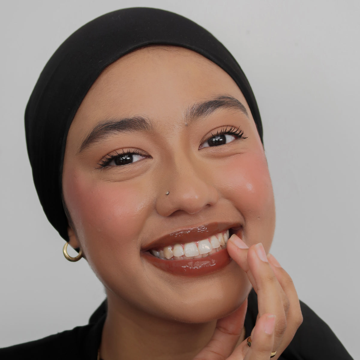 Peptide Glo Lip Oil in Coffee Run worn on model (3 of 4)