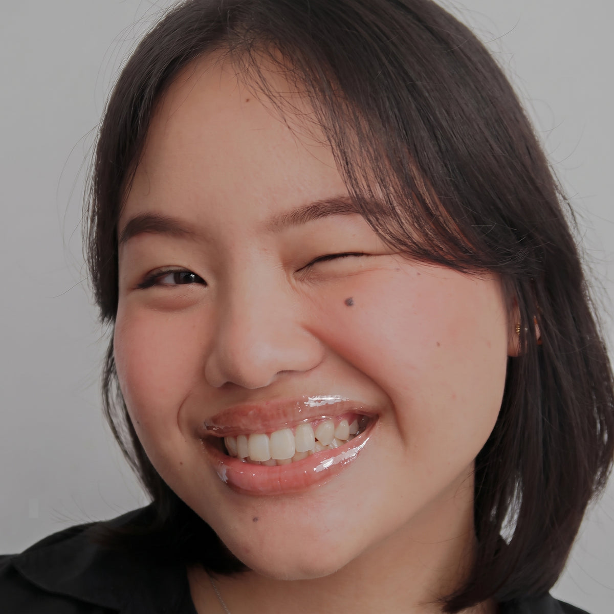 Peptide Glo Lip Oil in Crystal Clear worn on model (4 of 4)