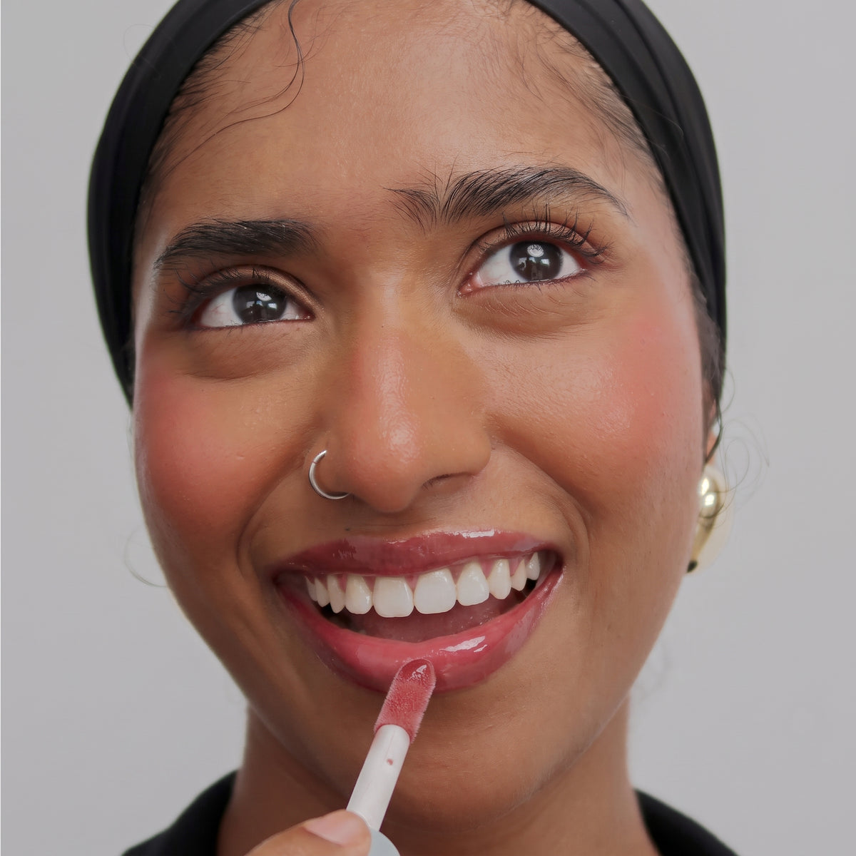 Peptide Glo Lip Oil in Gummy Bear worn on model (1 of 4)