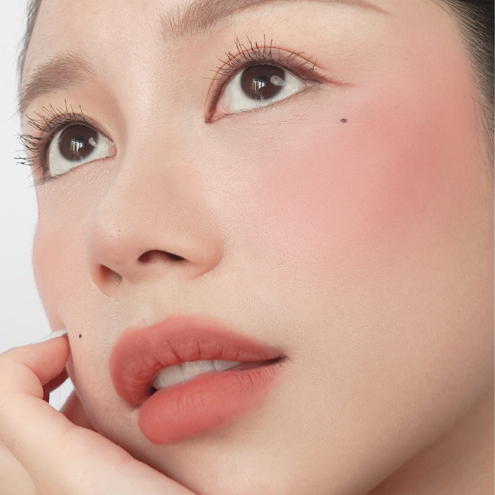 Hyaluronic Liquid Blush in Berry Sweet on fair skin