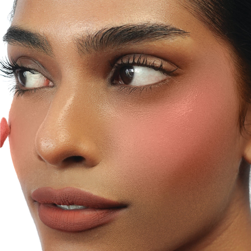 Hyaluronic Liquid Blush in Berry Sweet on tan skin