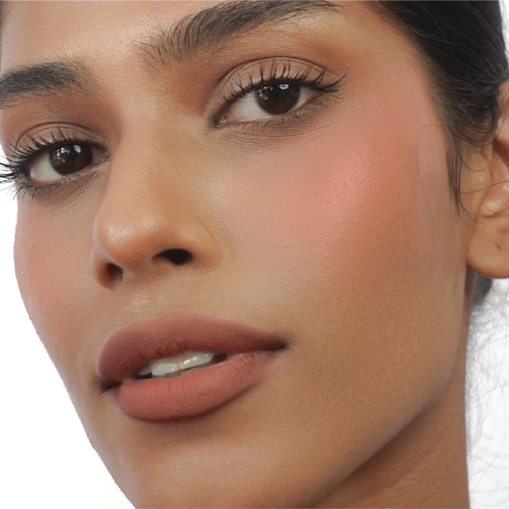 Hyaluronic Liquid Blush in Just Peachy on tan skin