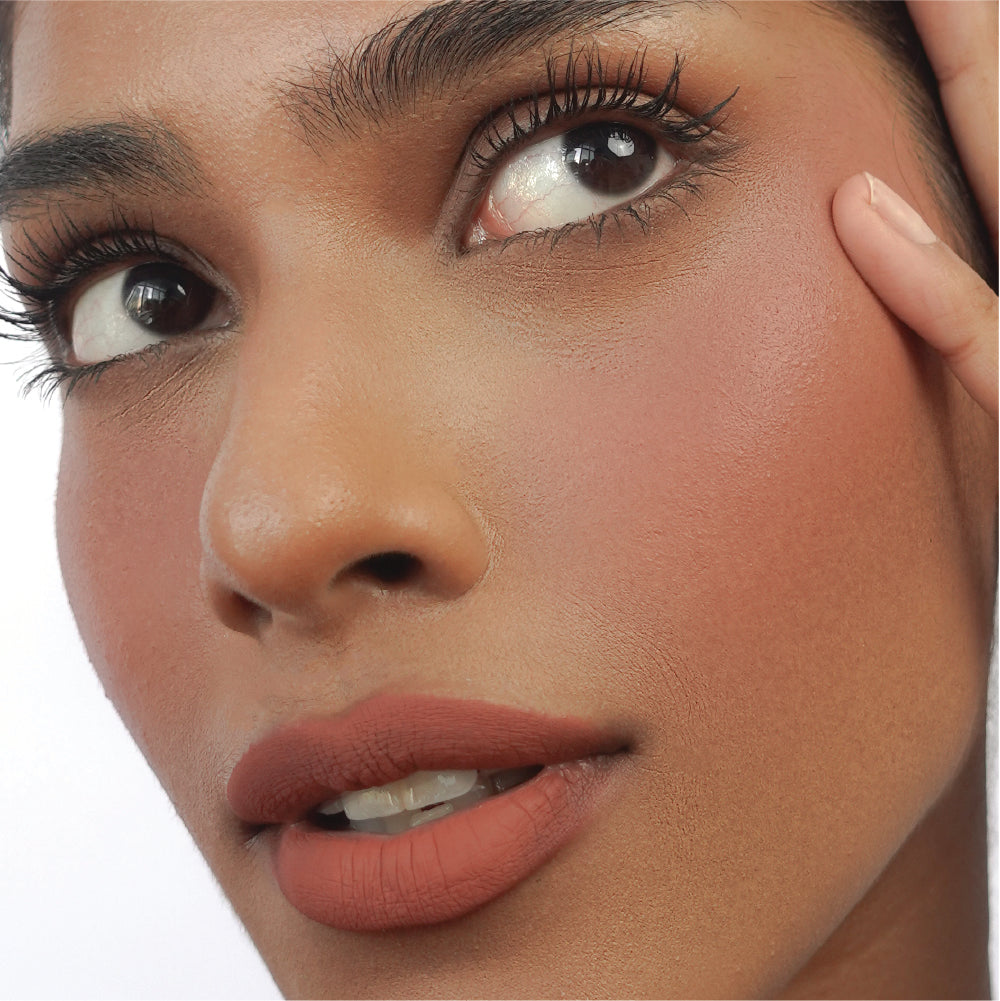 Hyaluronic Liquid Blush in Left On Red on tan skin