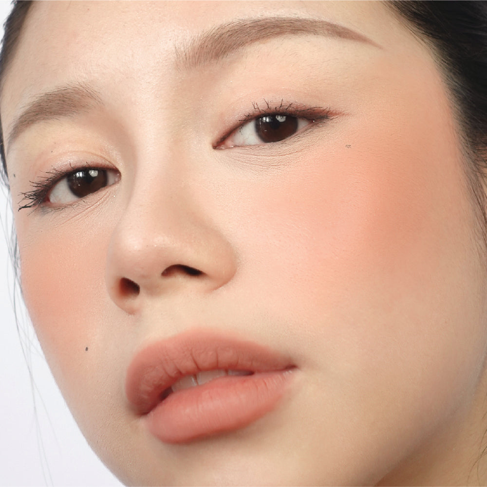 Hyaluronic Liquid Blush in Peachy Behaviour on fair skin