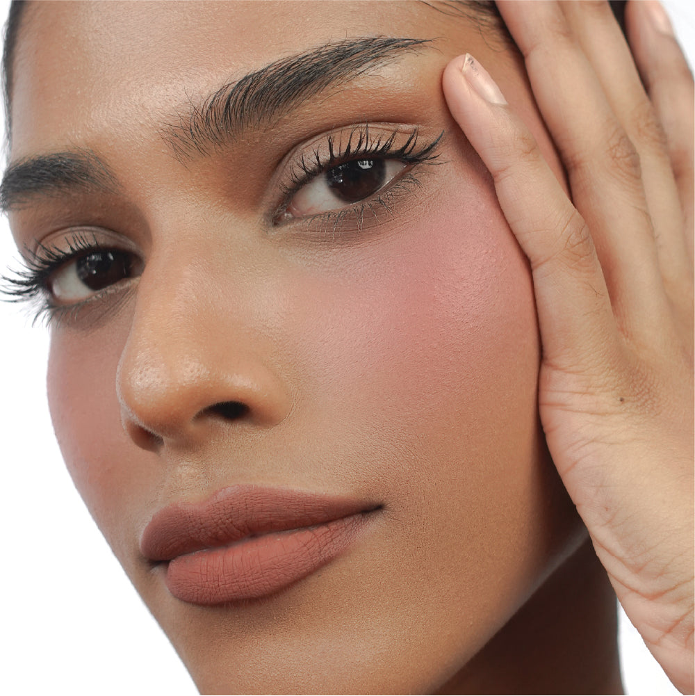 Hyaluronic Liquid Blush in Pinky Promise on tan skin