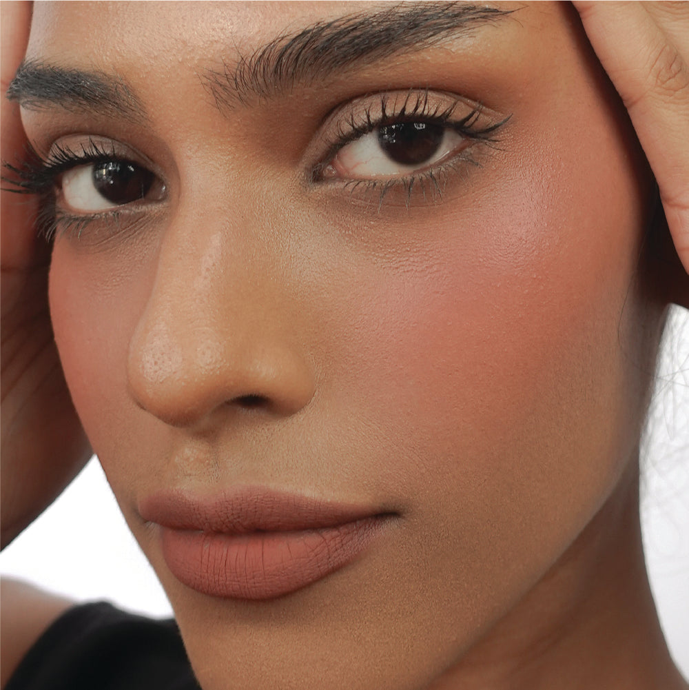 Hyaluronic Liquid Blush in She's That Girl on tan skin