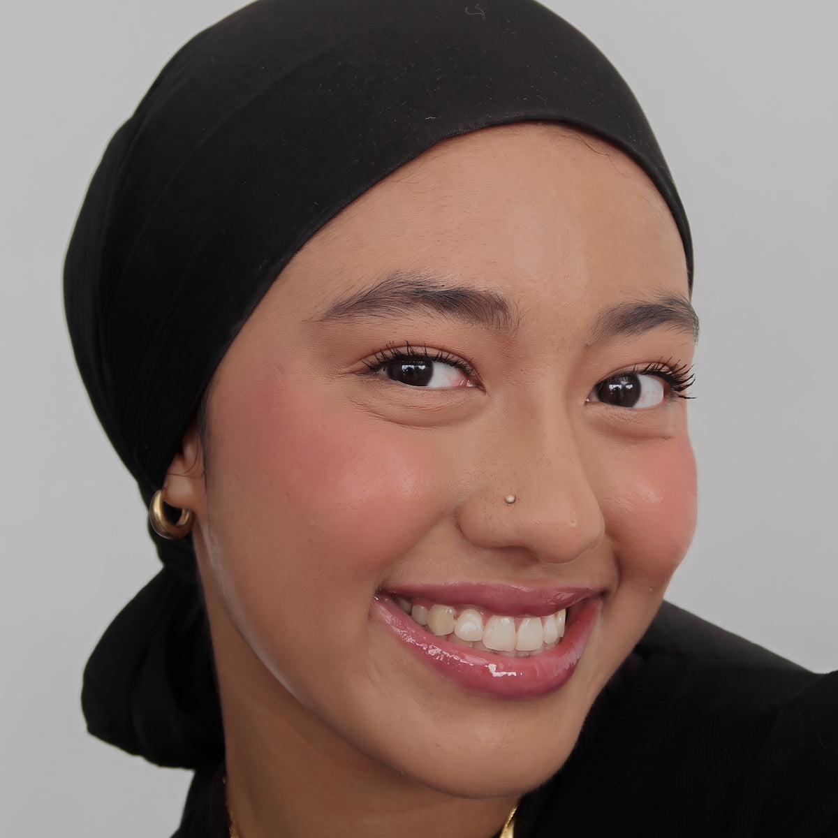 Peptide Glo Lip Oil in Mauvewood worn on model (1 of 4)