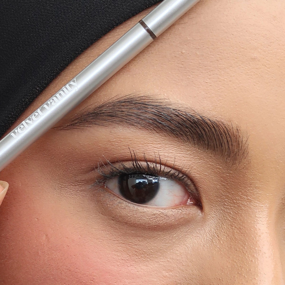 Soft Trace Brow Pencil in Dark Brown on medium skin