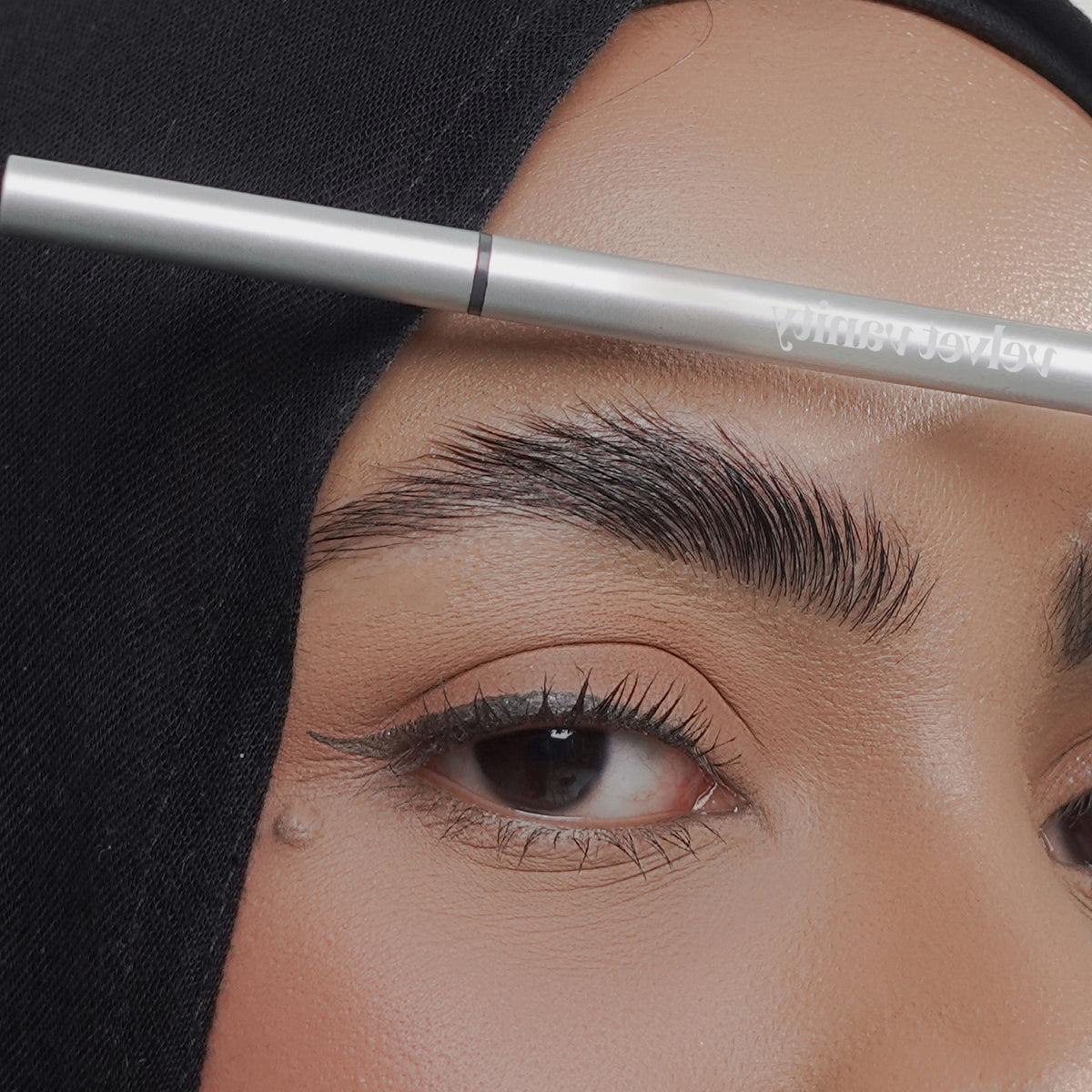 Soft Trace Brow Pencil in Smokey Grey on tan skin