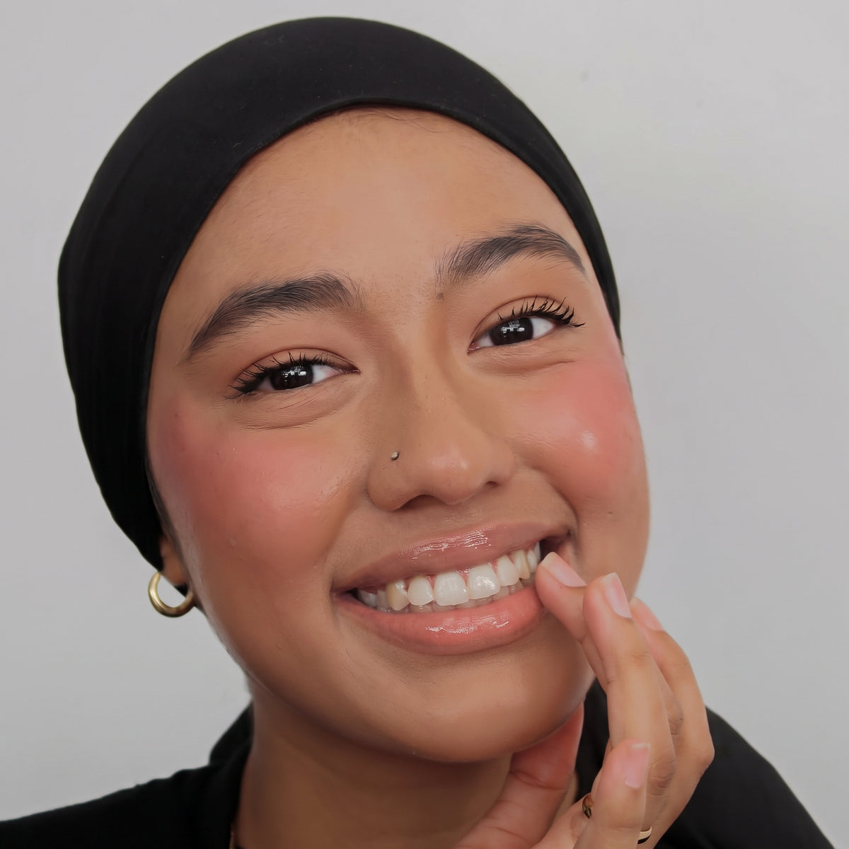 Peptide Glo Lip Oil in Sunset Peony worn on model (1 of 4)