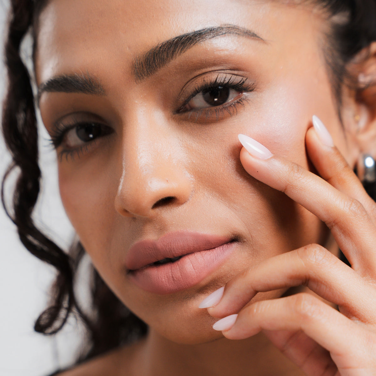 Soft Blur Glide-On Lipstick in Bloom on tan skin
