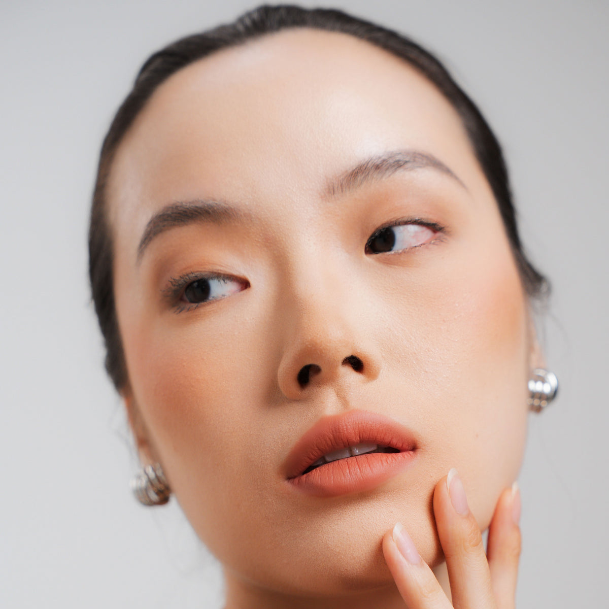 Soft Blur Glide-On Lipstick in Linen on fair skin