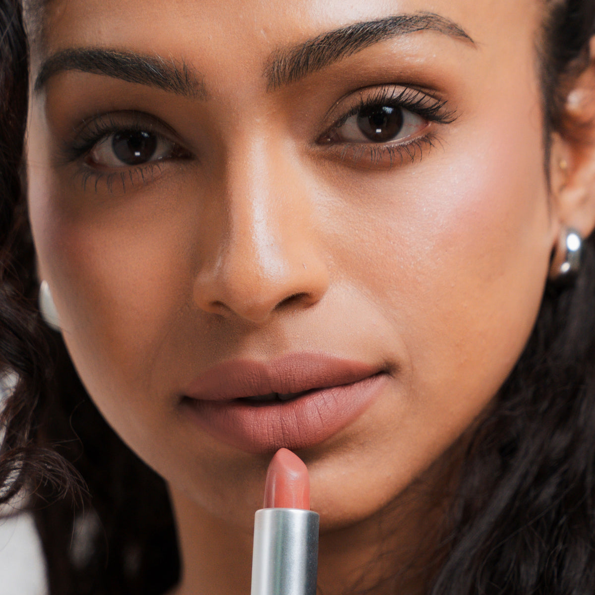 Soft Blur Glide-On Lipstick in Marsala on tan skin