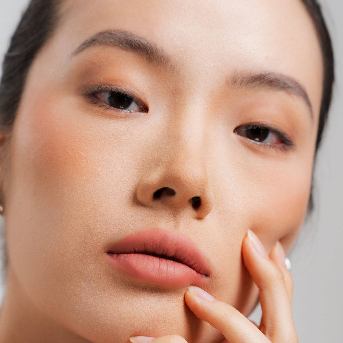 Soft Blur Glide-On Lipstick in Petal on fair skin