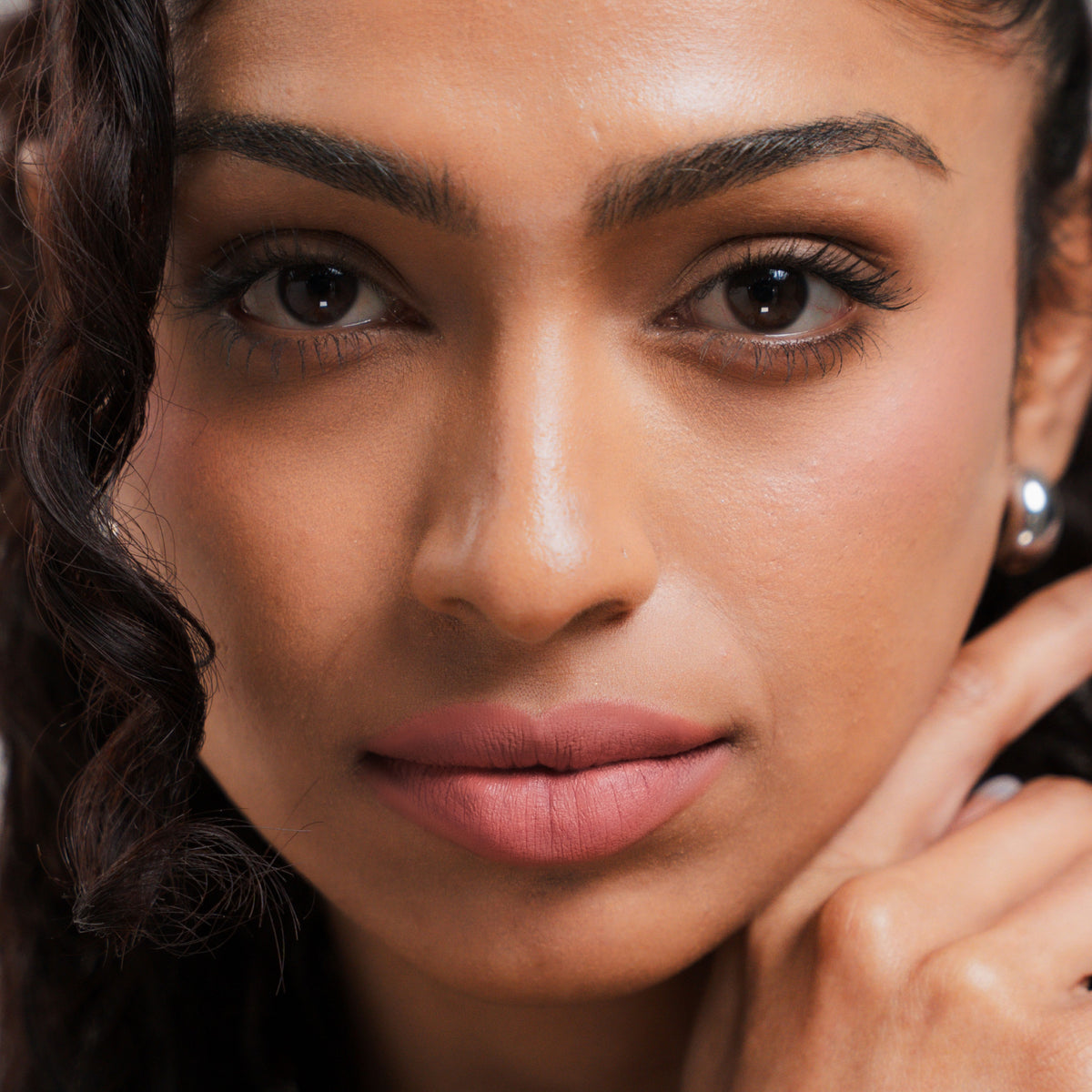 Soft Blur Glide-On Lipstick in Petal on tan skin