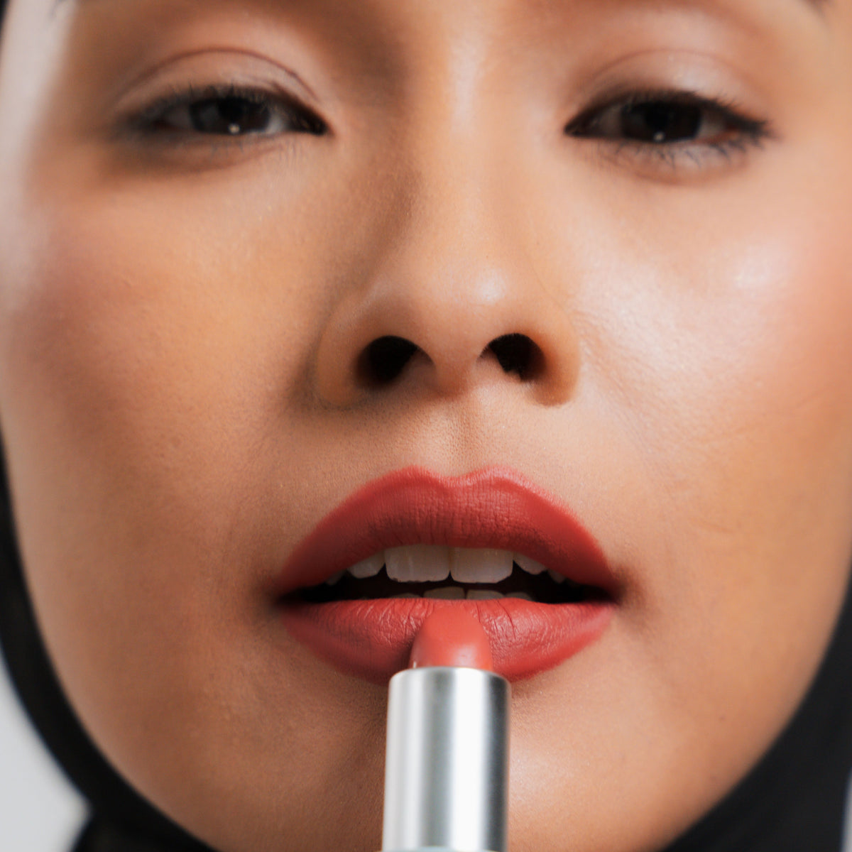 Soft Blur Glide-On Lipstick in Sorbet on medium skin
