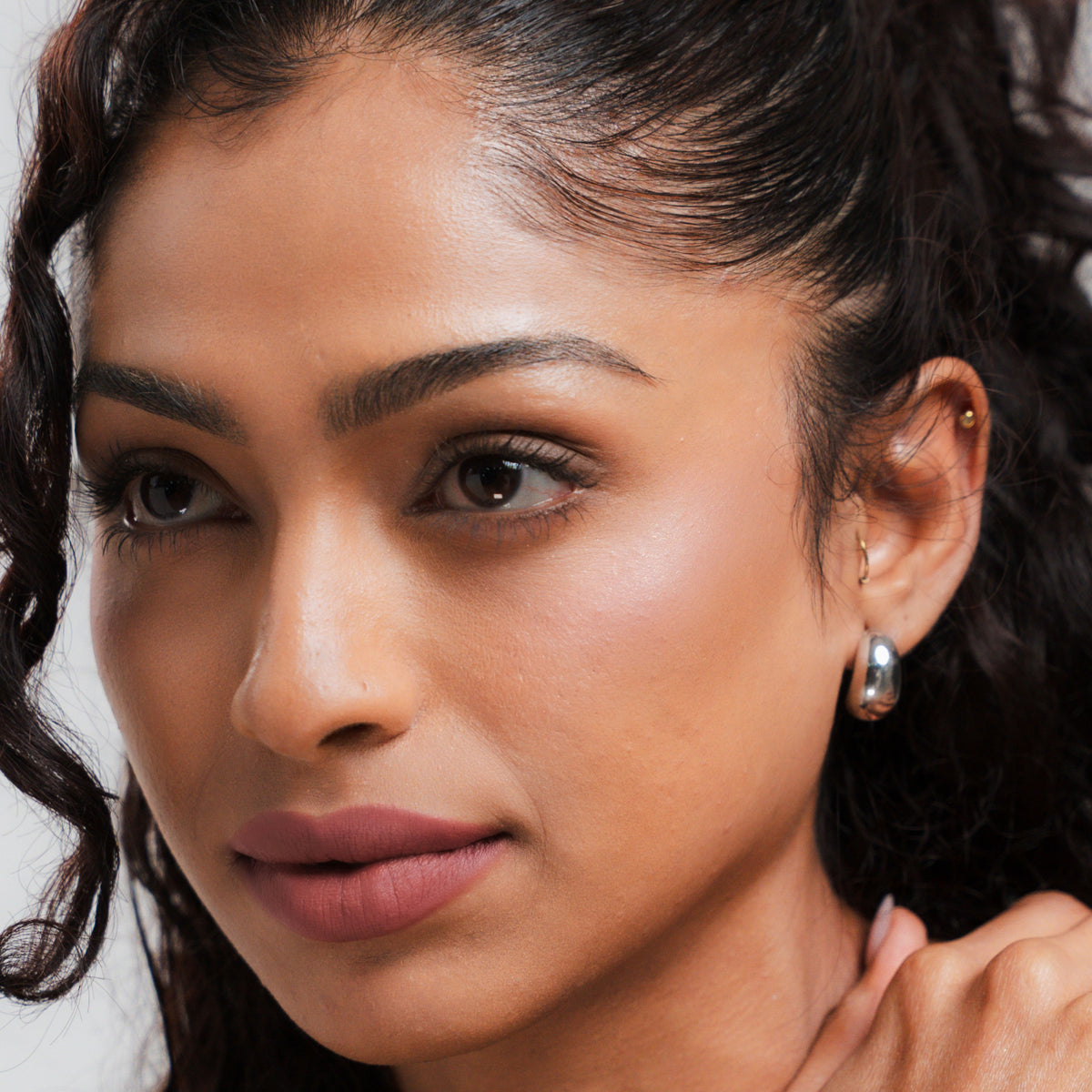 Soft Blur Glide-On Lipstick in Whimsy on tan skin